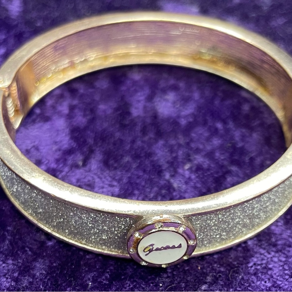 Guess Gold-Tone Glitter Bangle Bracelet with Signature Medallion